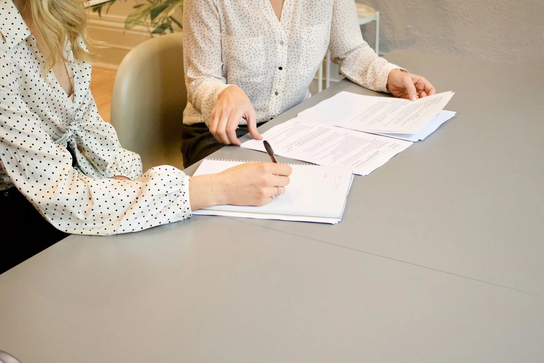 A person carefully reviewing a property contract — representing the importance of proper legal support in any property transaction.